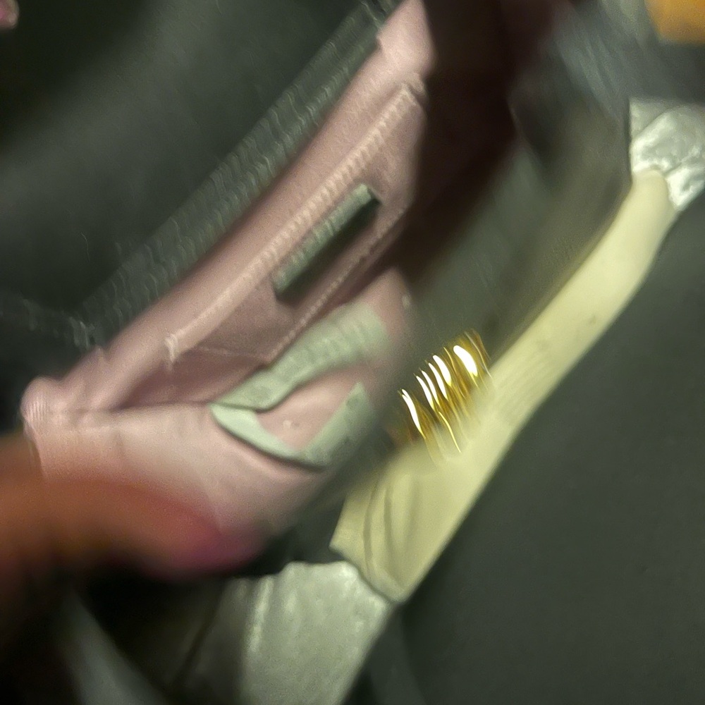 Versace black purse with a hint of gold